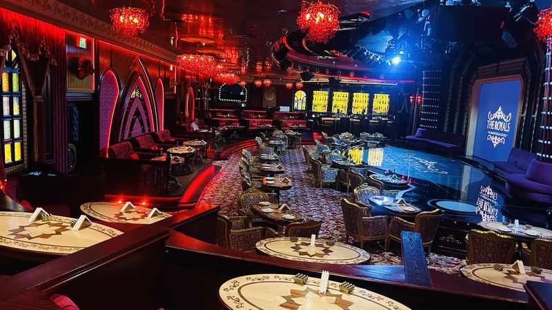 The stage screen lit blue above the dance floor
